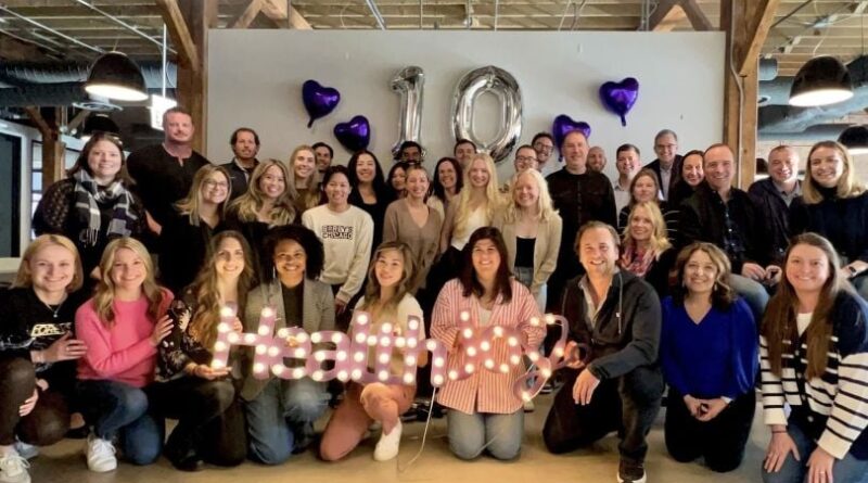 The HealthJoy team takes a group photo at the company's tenth anniversary celebration.